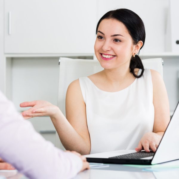 Young female manager meeting woman client in office